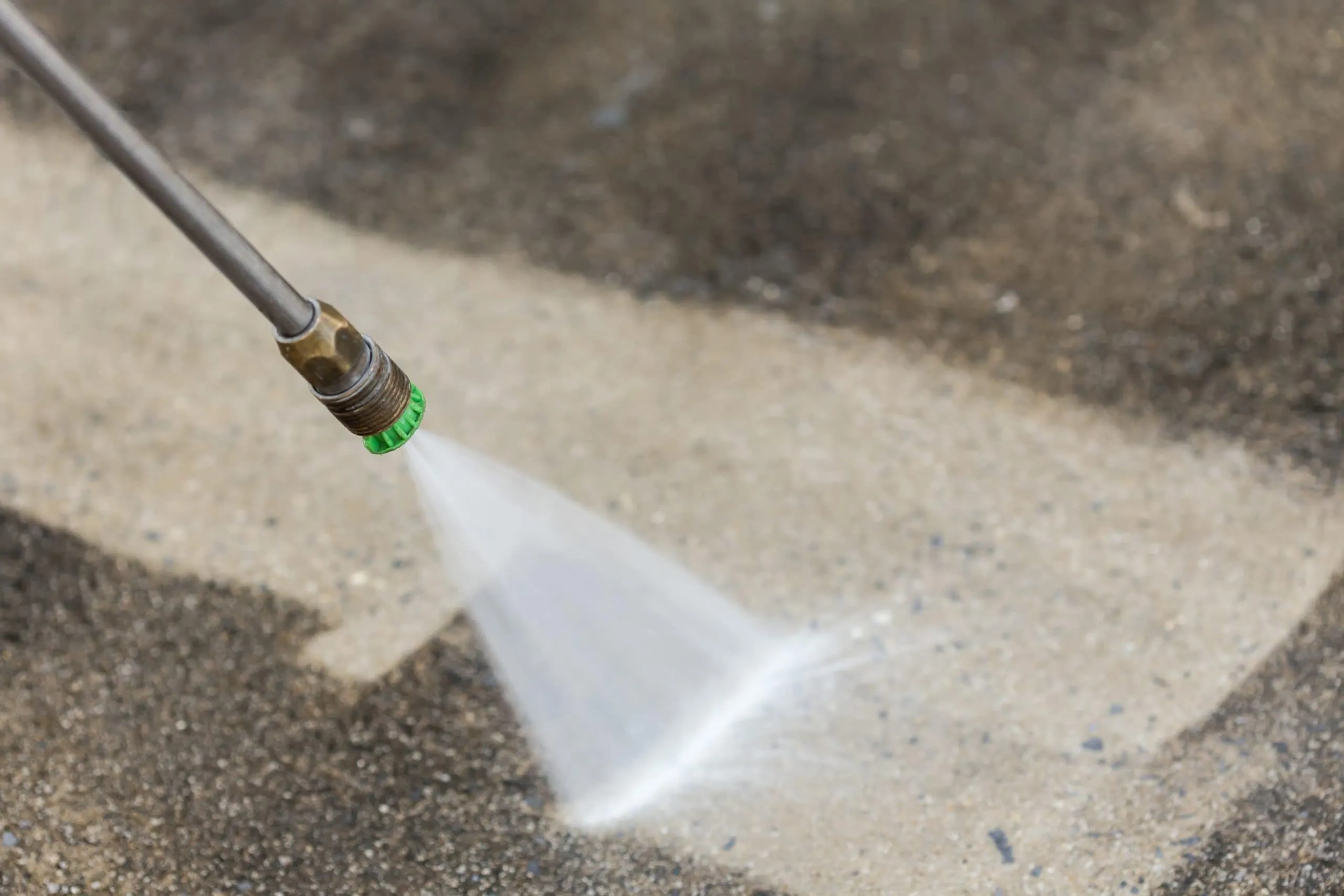 David’s Lawn Care seal coating in Portage driveway